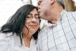 a man and a woman kissing each other