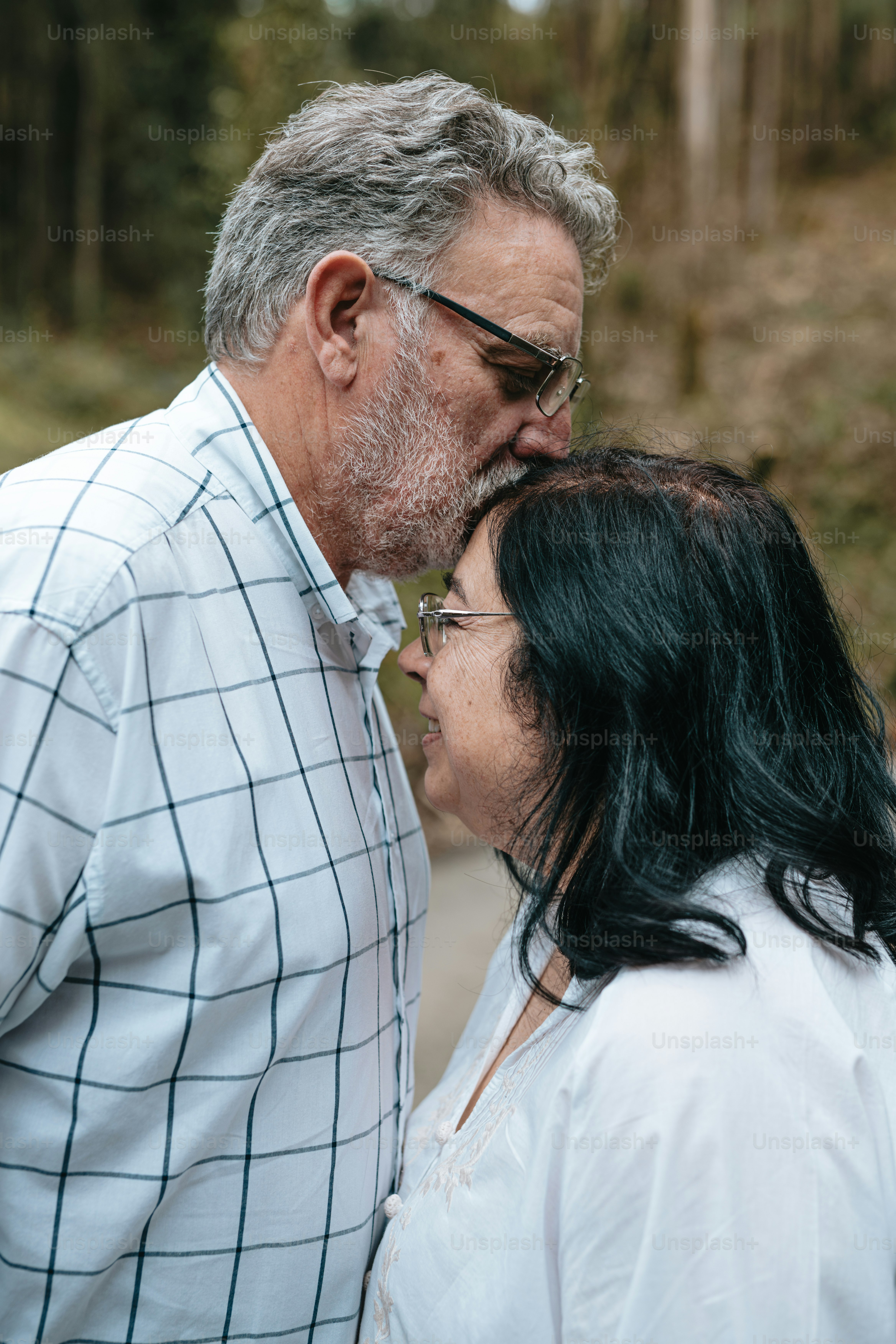 A man and a woman standing next to each other photo – Outdoor Image on ...