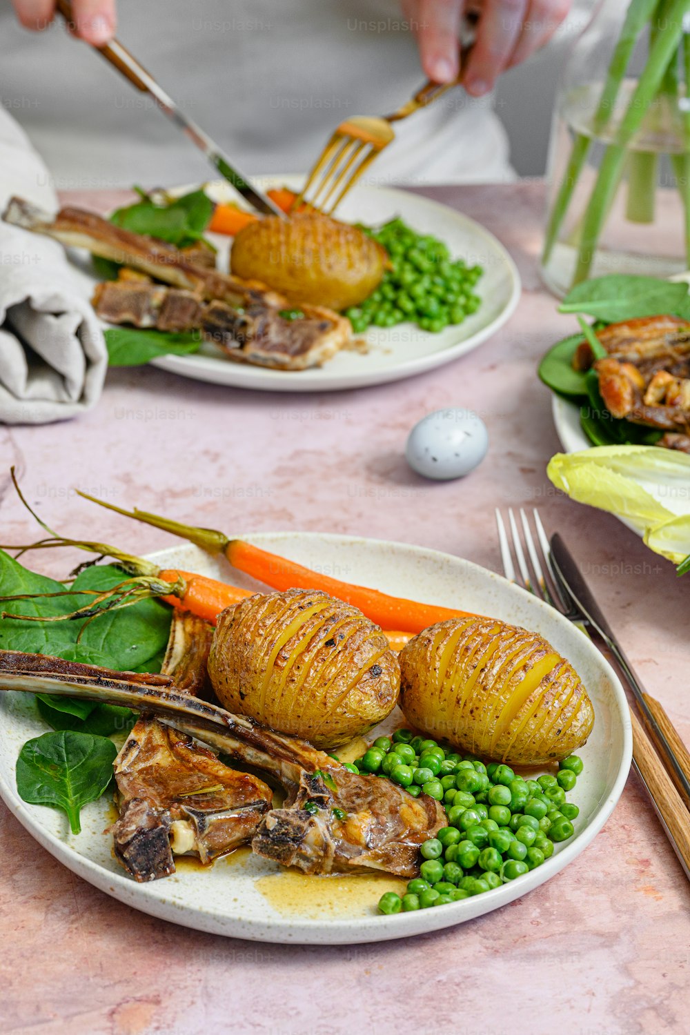 a plate of food on a table with a fork and knife