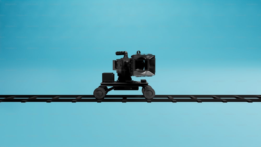 a camera sitting on top of a train track