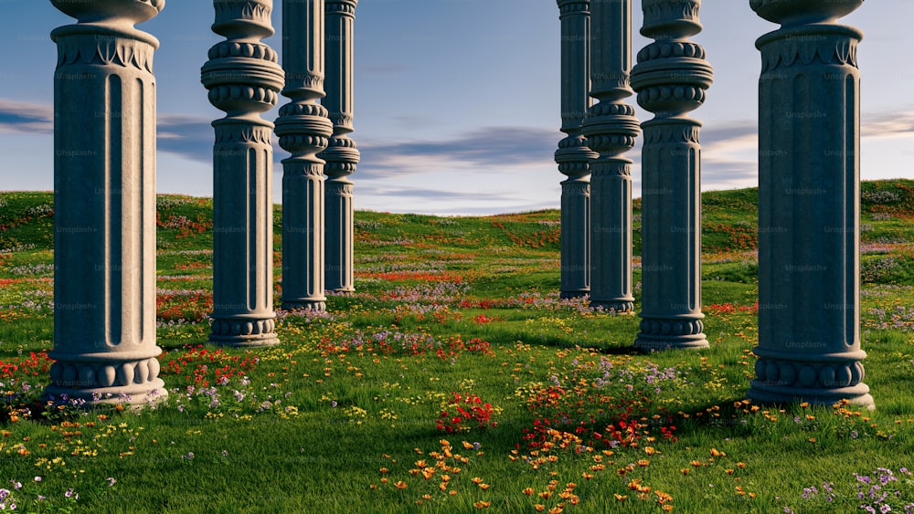 a bunch of pillars that are in the grass
