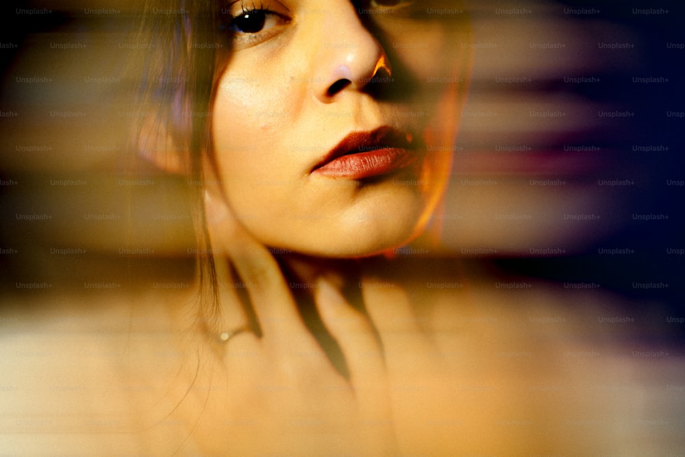 a close up of a woman's face with a blurry background