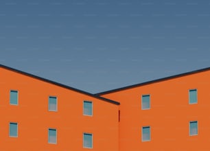 a large orange building with windows and a clock