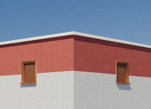 a red and white building with two windows