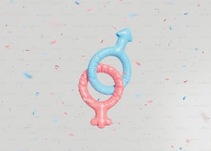 un ballon bleu et rose en forme de symbole féminin