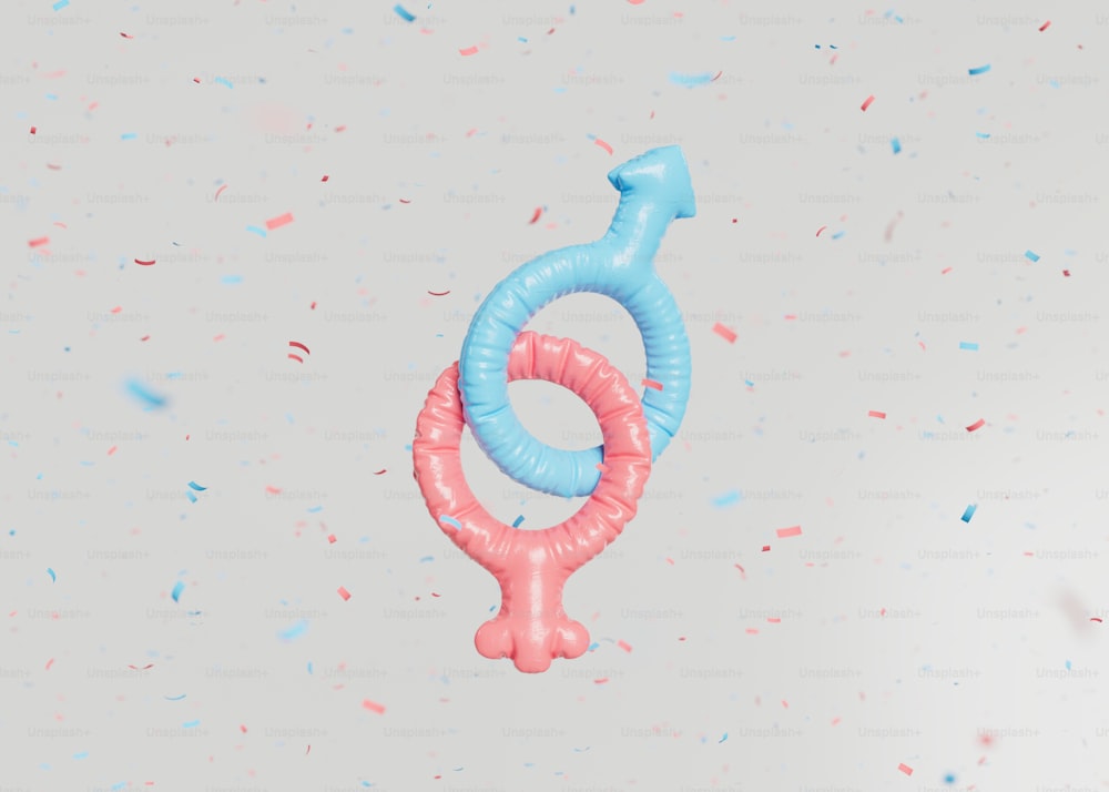 a blue and pink balloon shaped like a female symbol