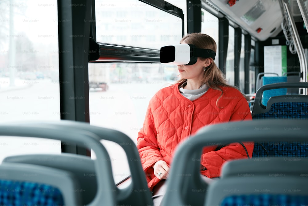 a woman wearing a blindfold on a bus