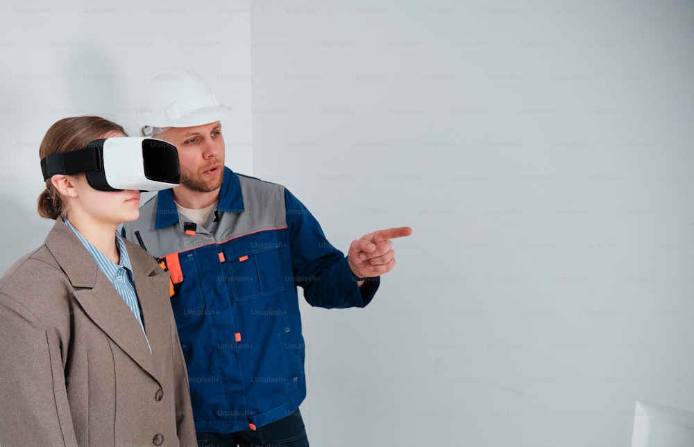 a man and a woman wearing hard hats