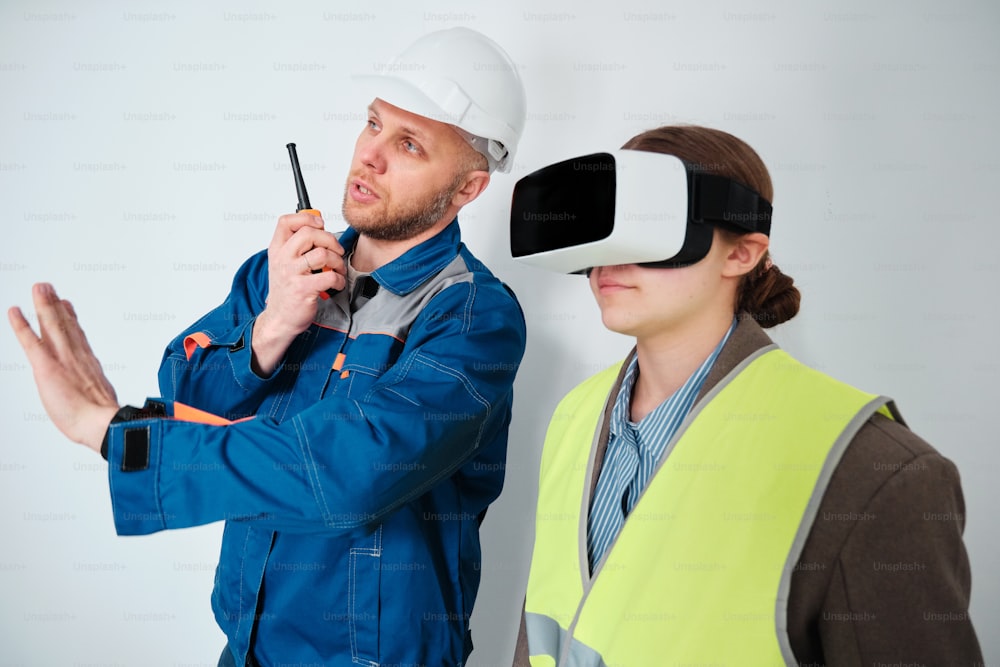 a man and a woman wearing virtual headsets