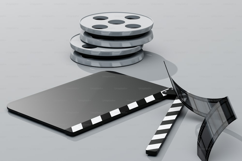 a film reel and a film strip on a table
