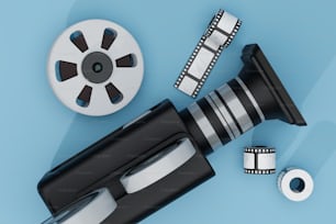 a camera, film, and a roll of tape on a blue background