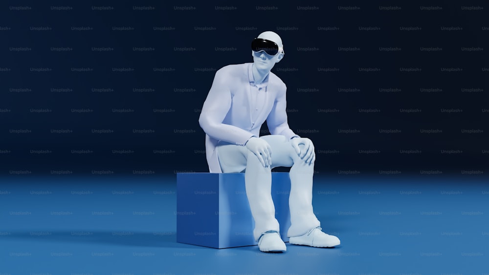 um homem branco sentado em cima de um bloco azul