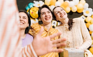 a group of women standing next to each other