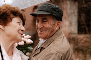 a man and a woman standing under an umbrella