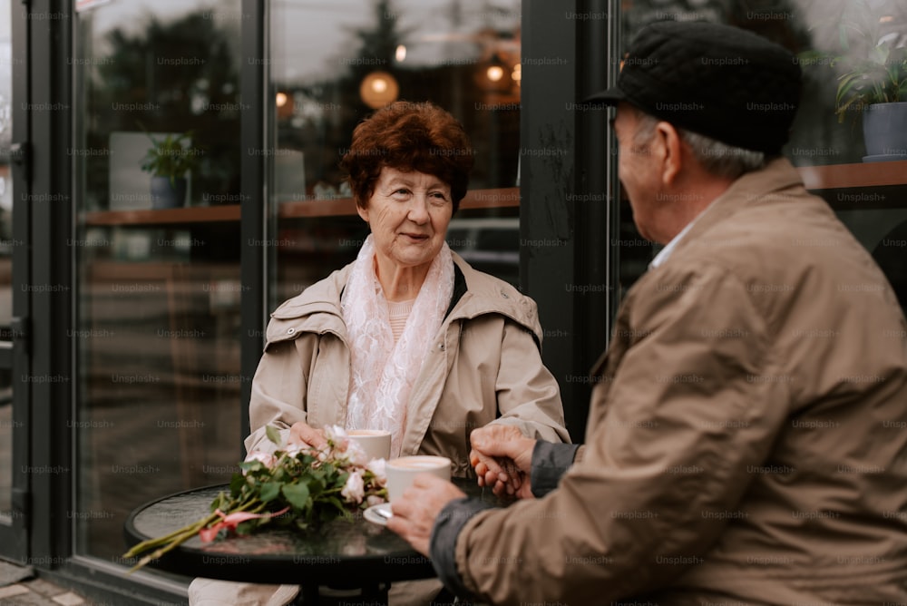 a man and a woman sitting at a table