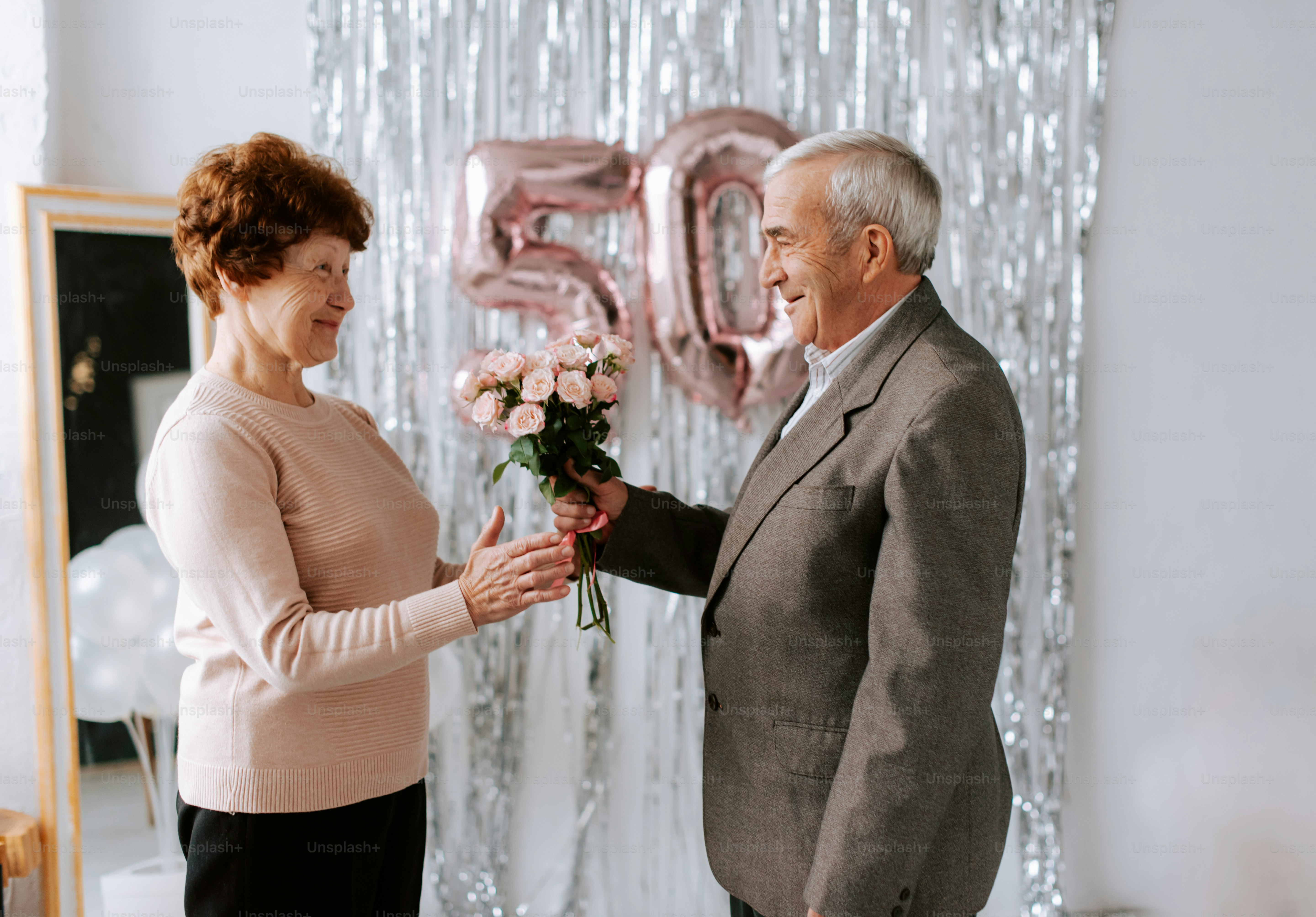 Couple creating romantic bouquets with anniversary flowers for a special occasio