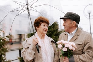 a man and a woman standing under an umbrella