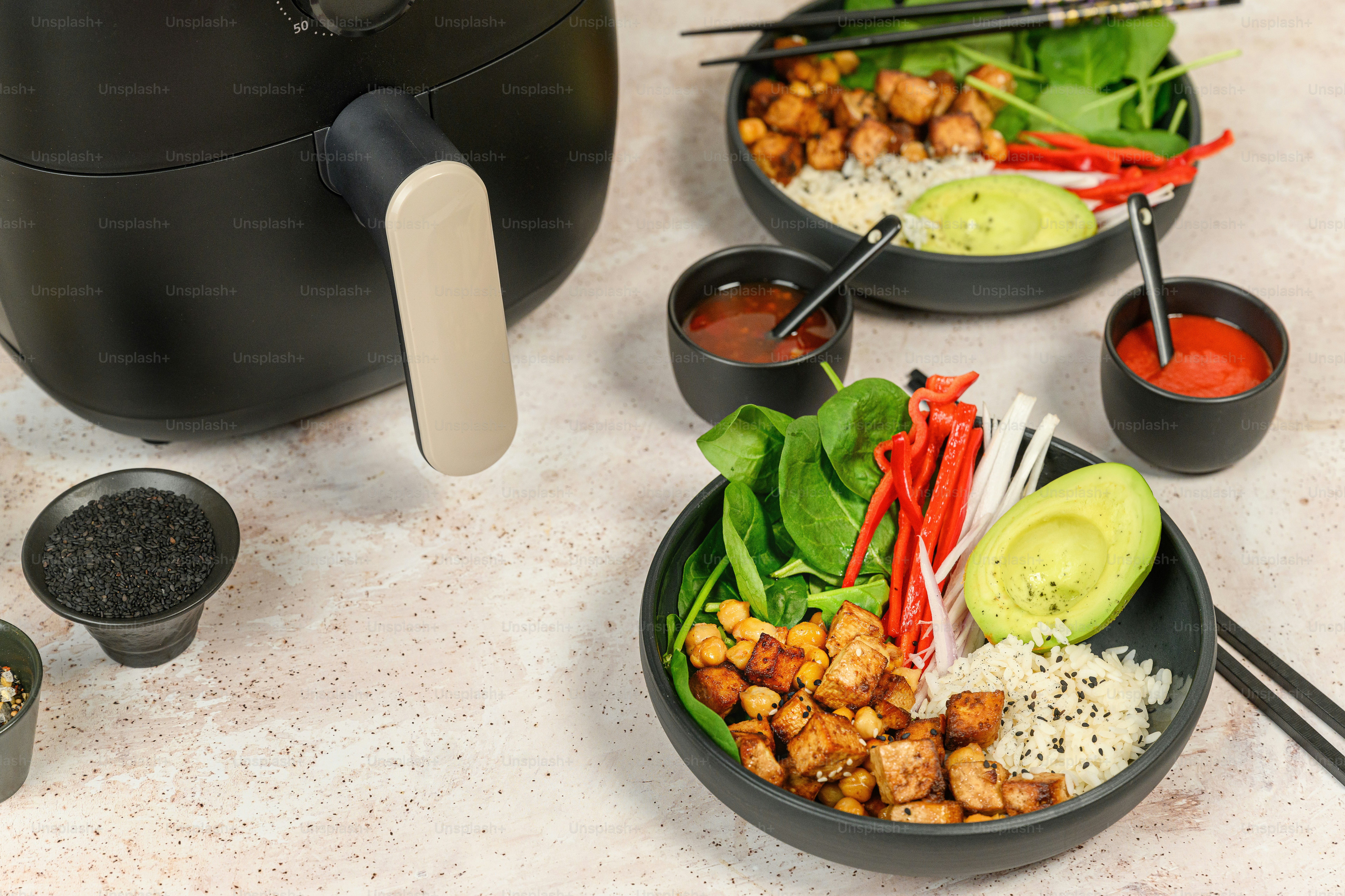 a table topped with bowls filled with food