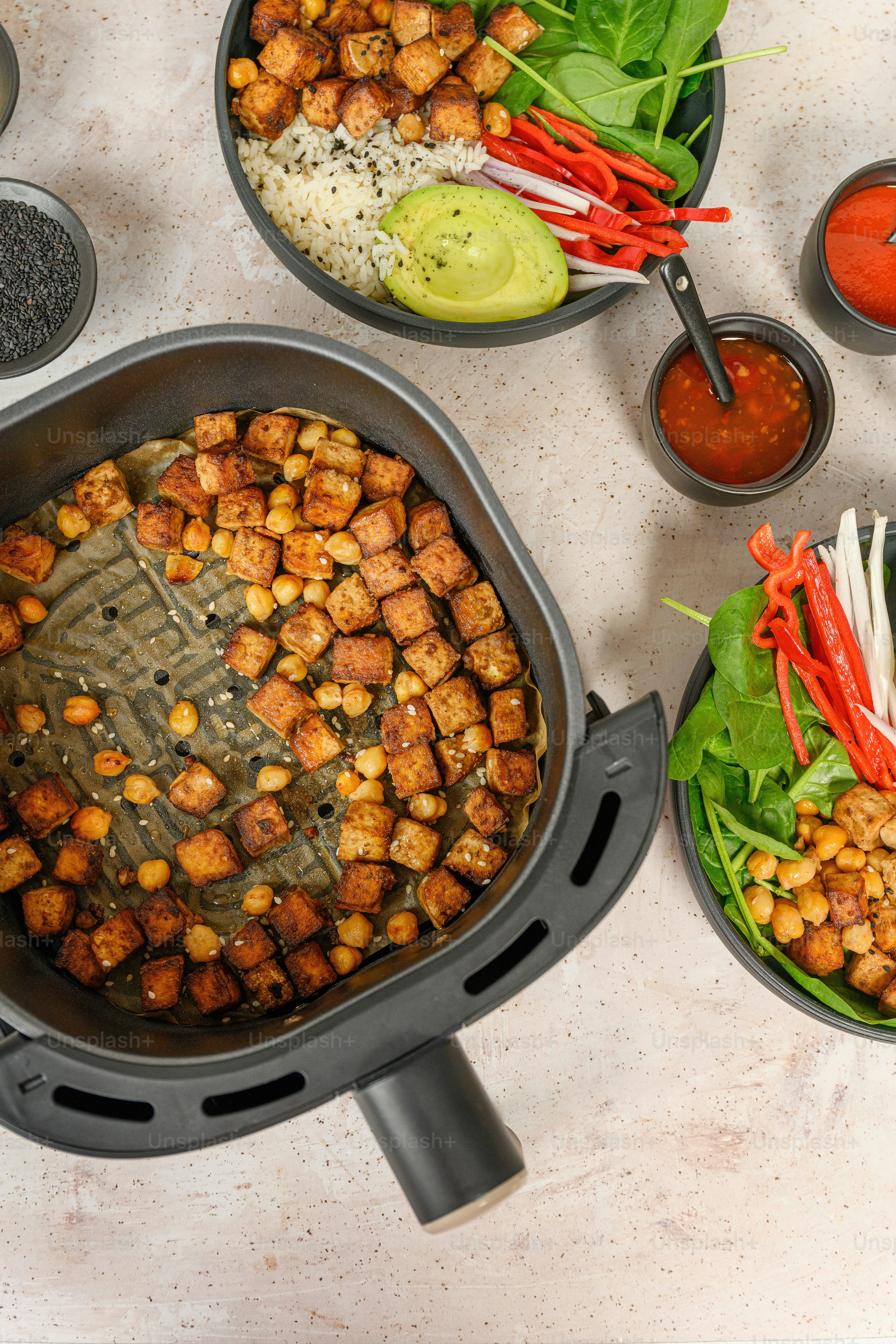 a table topped with bowls filled with food