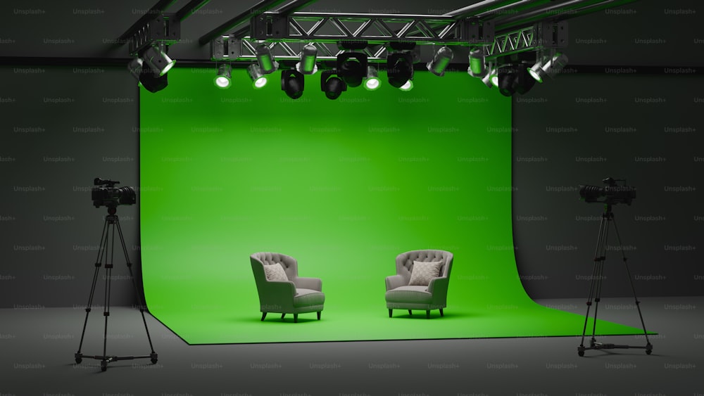 a green screen with two chairs in front of it