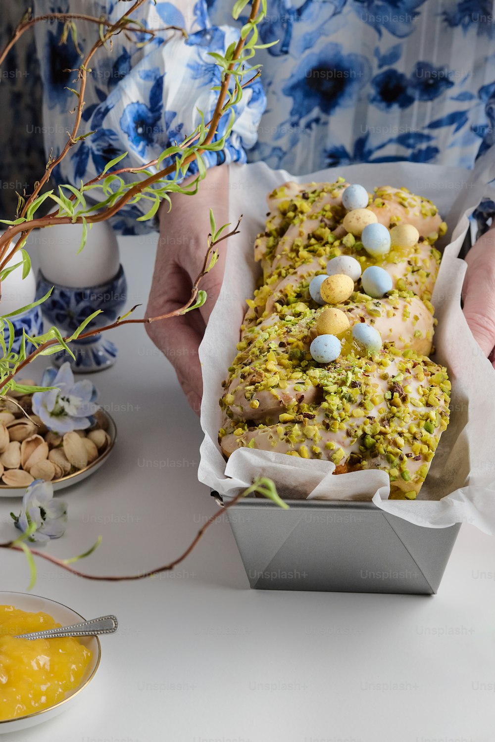 a person holding a tray of food with eggs on it