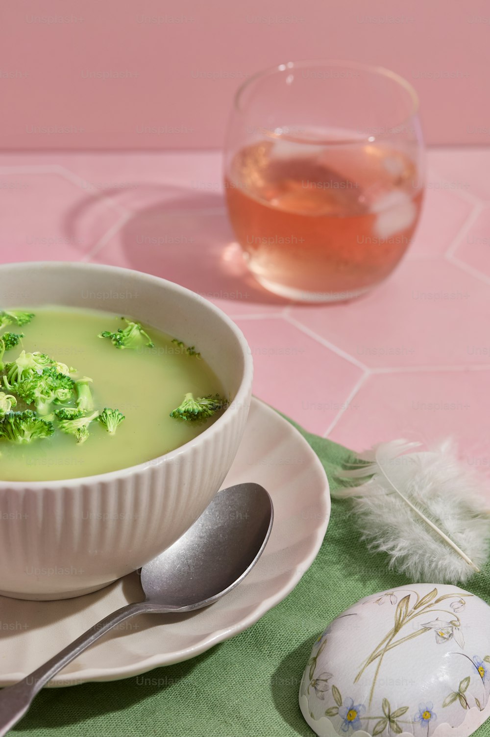 a bowl of broccoli soup with a spoon
