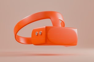 ein Paar orangefarbene Kopfhörer, die übereinander sitzen