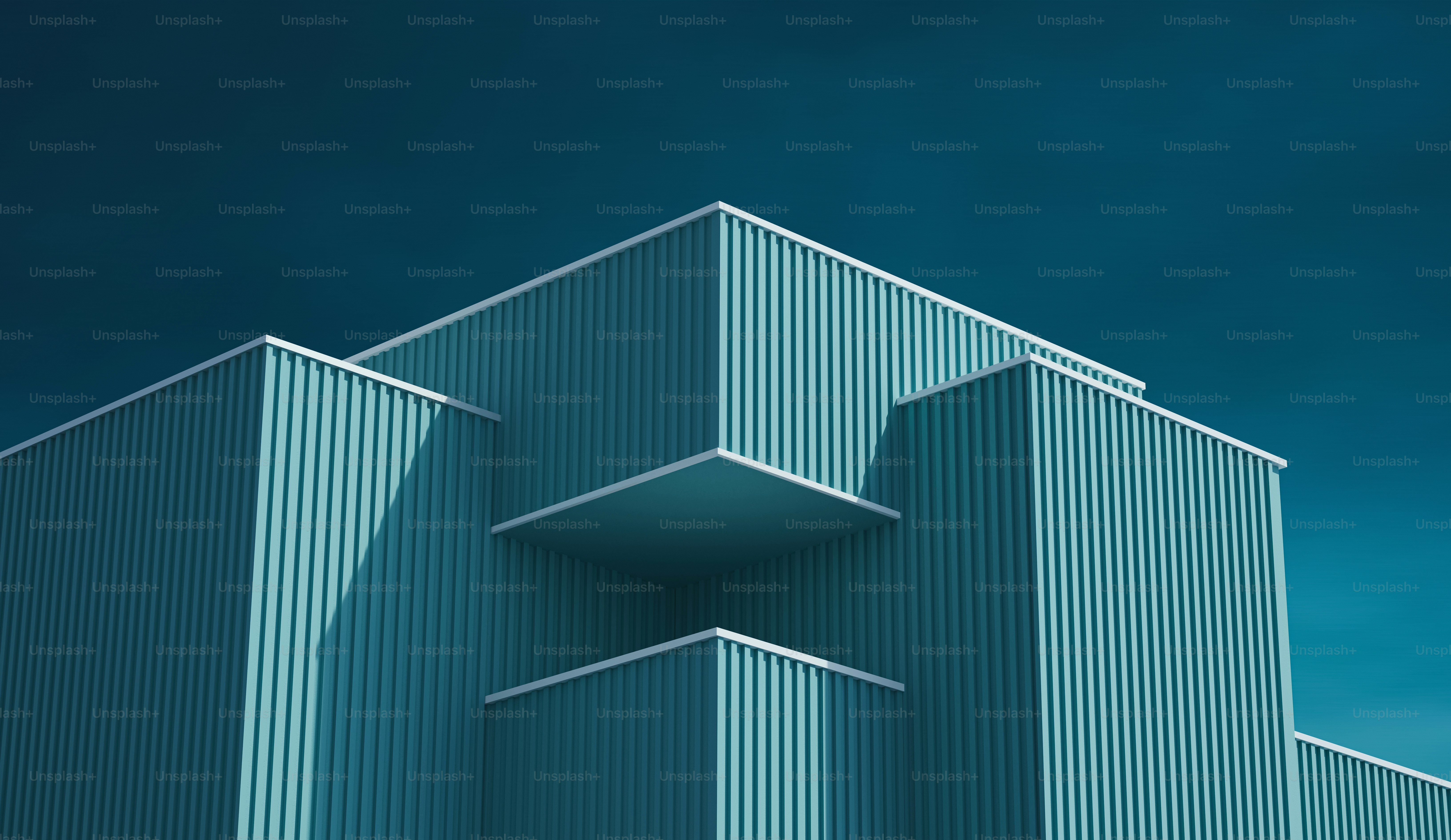 a blue building with a sky in the background