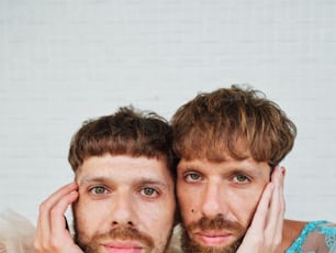 two men are posing for a picture together
