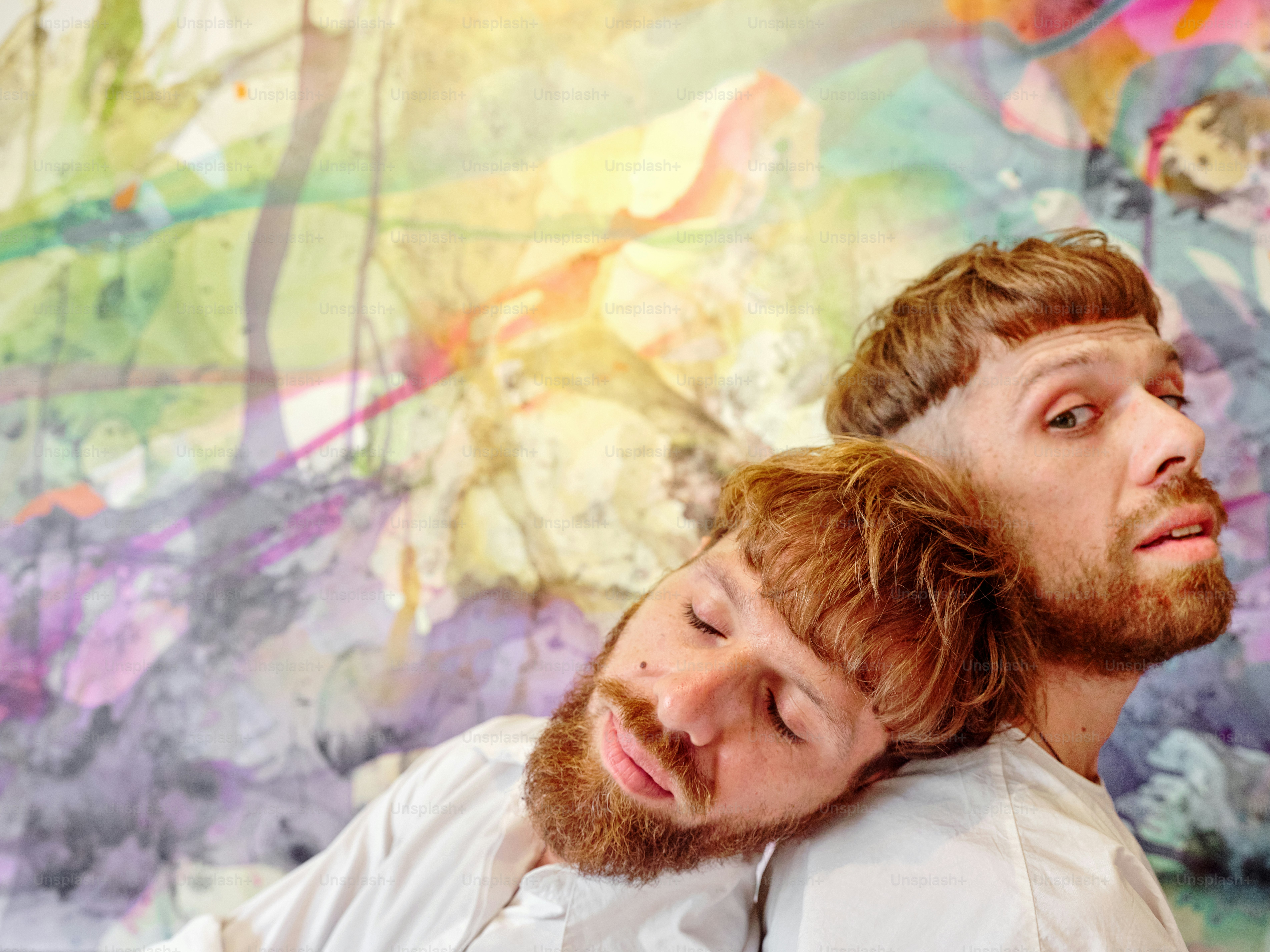 a couple of men standing next to each other