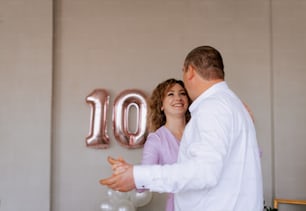 a man and a woman standing next to each other