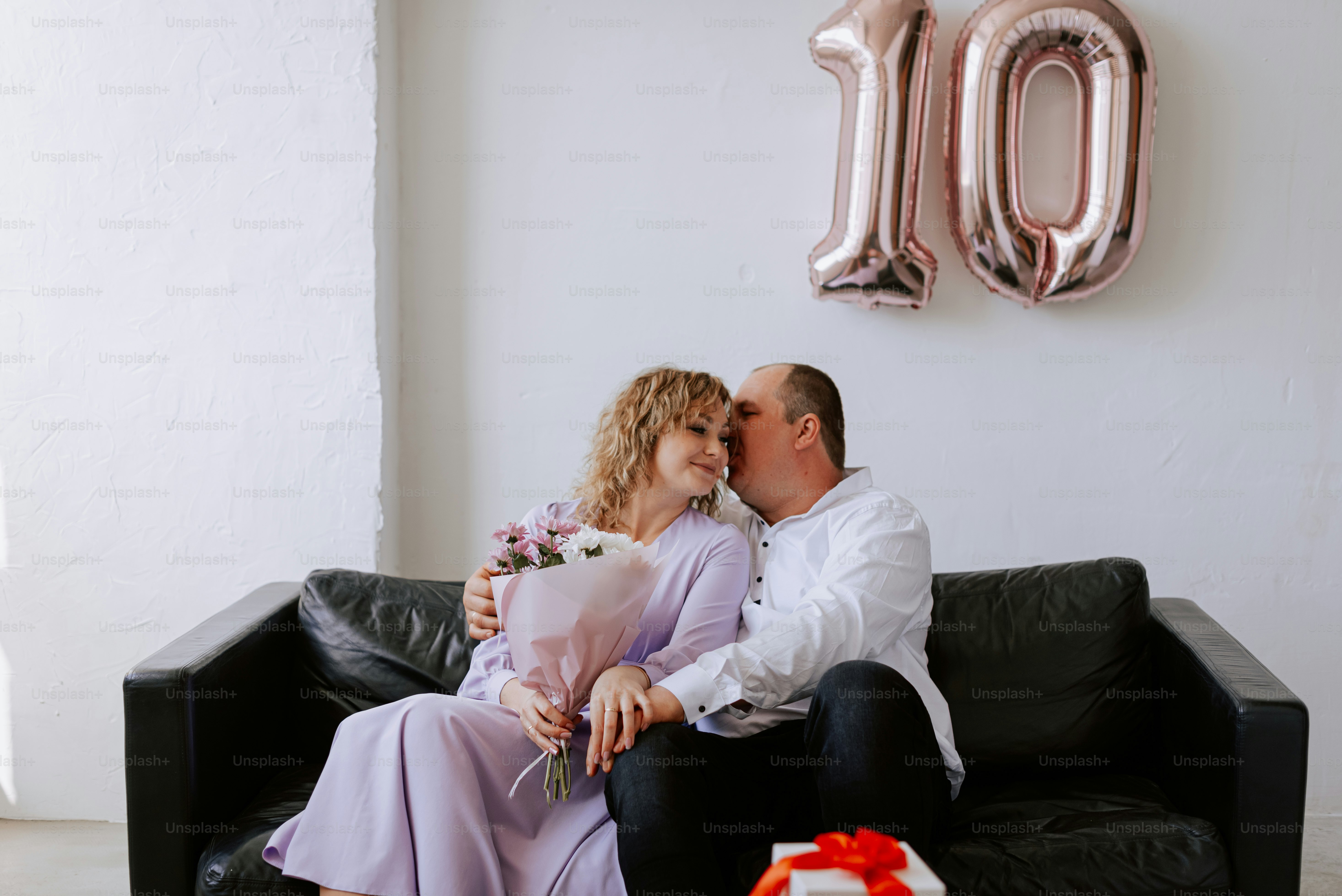 a man and a woman sitting on a couch
