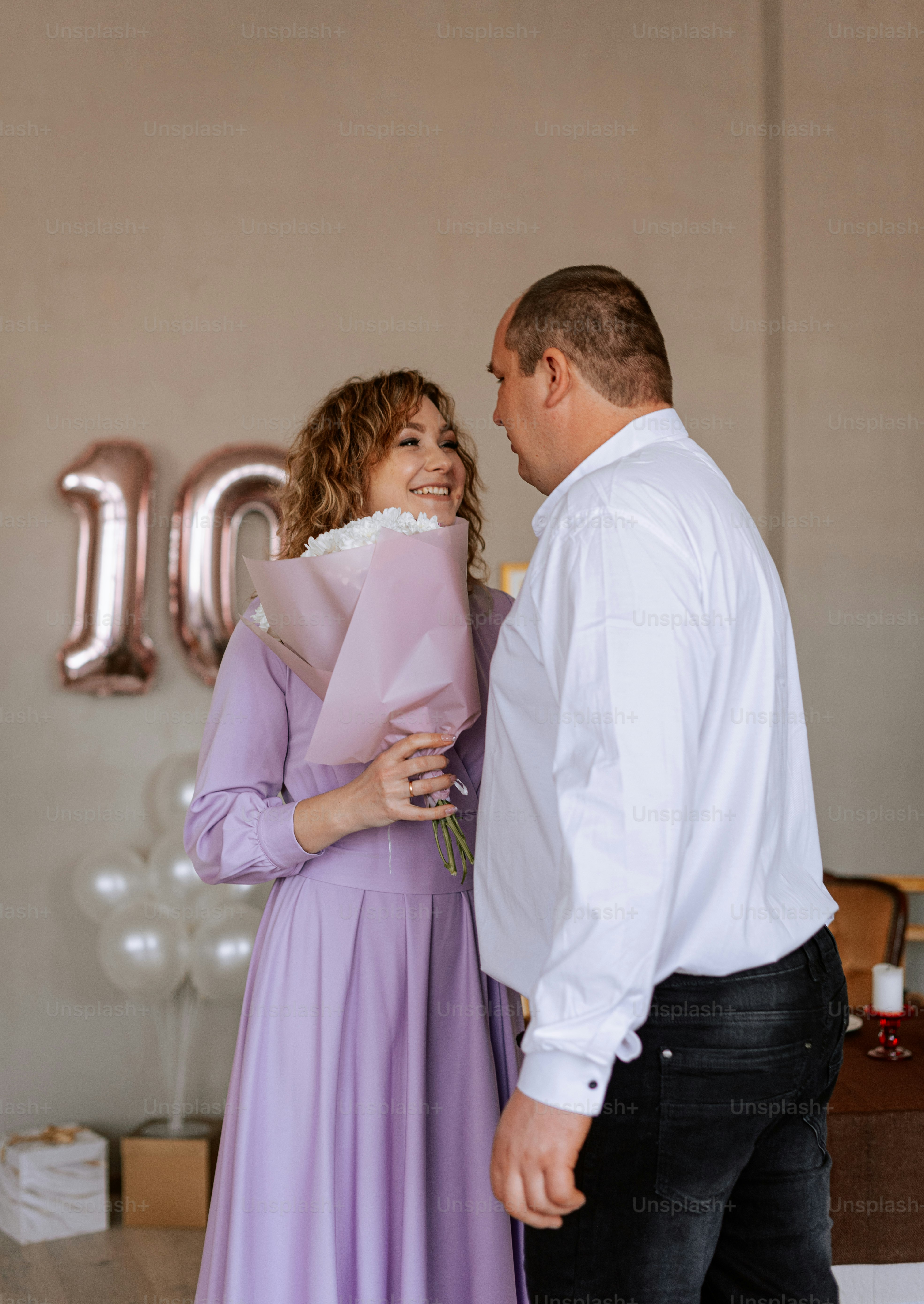 a man and a woman standing next to each other