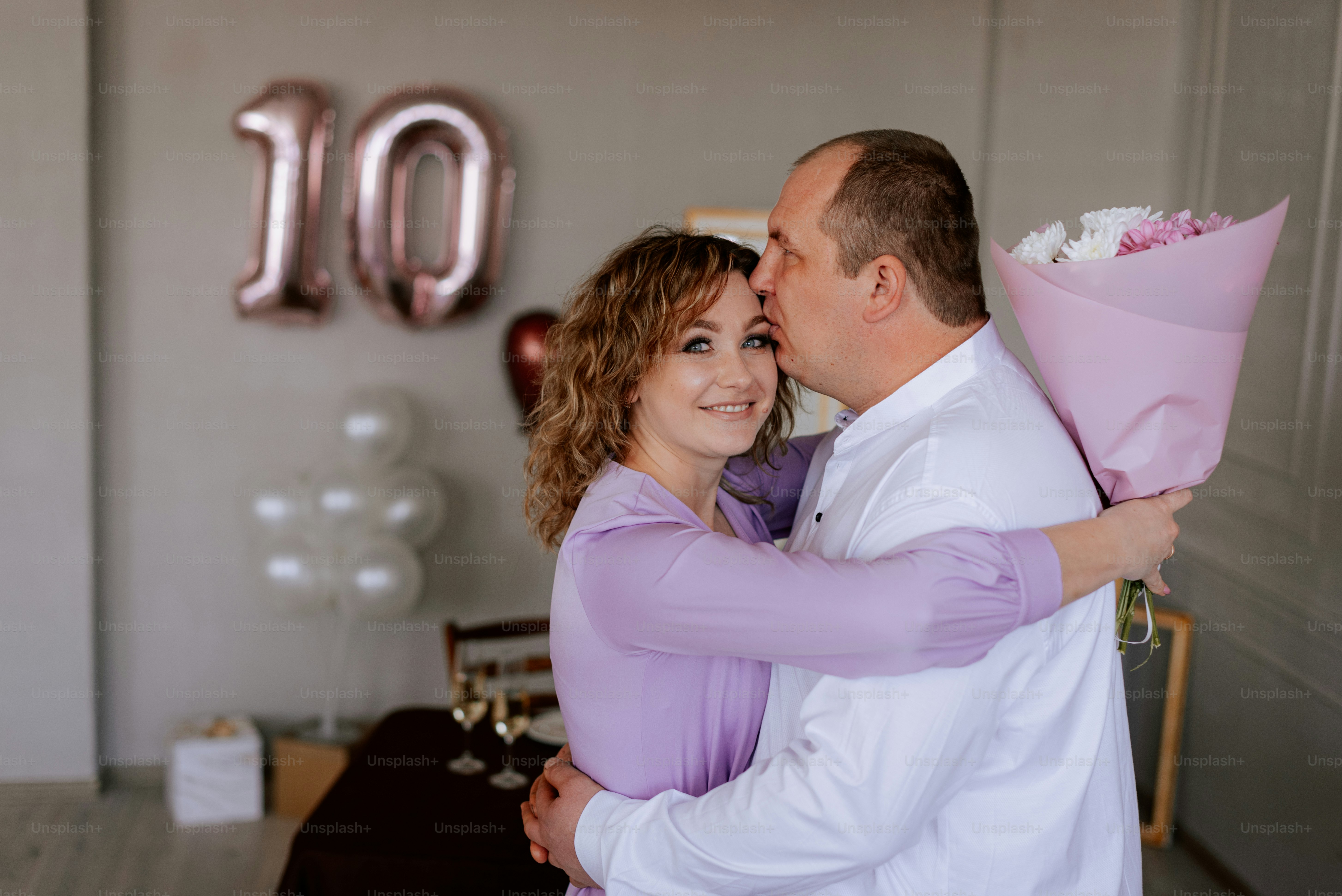 a man and a woman embracing each other