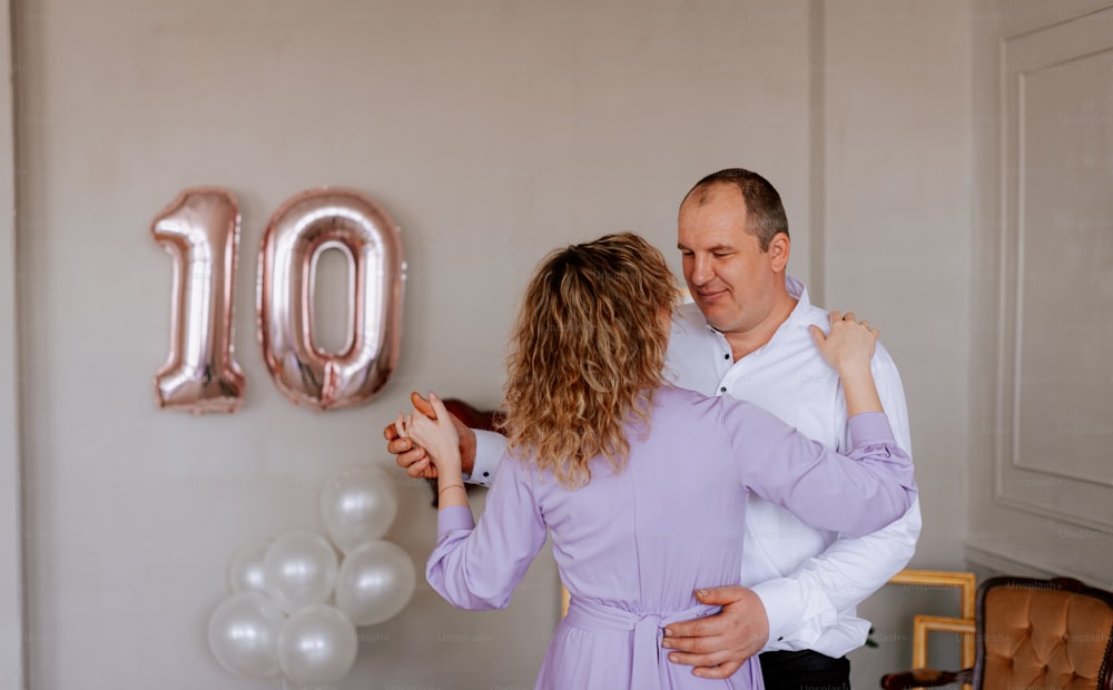 a man and a woman standing next to each other