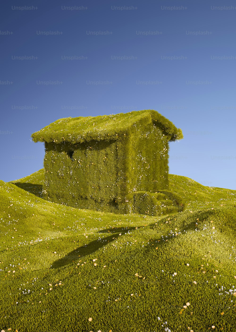 a house made of grass sitting on top of a hill