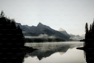 a body of water with mountains in the background