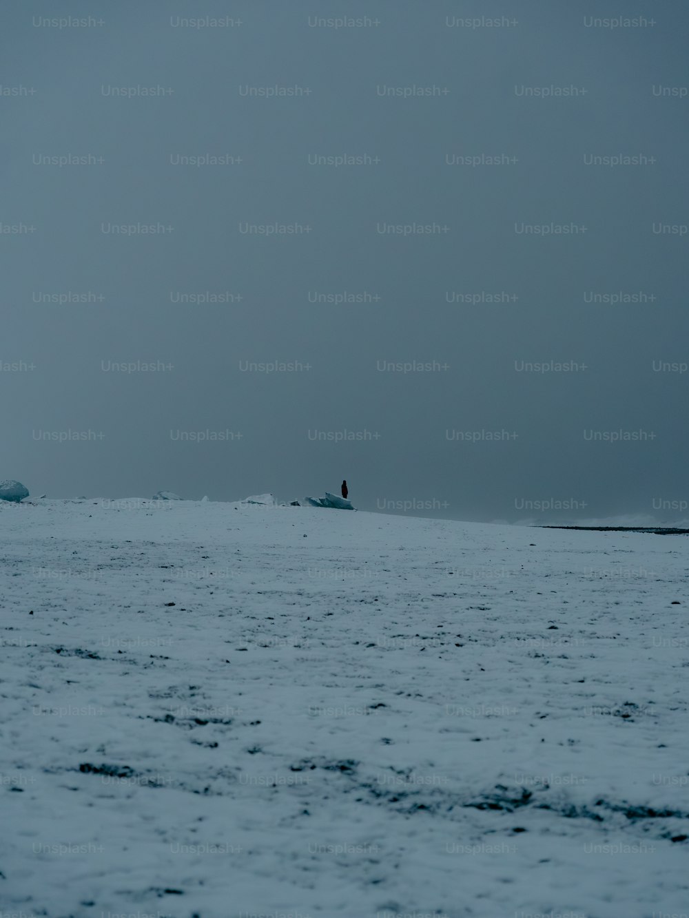 a person standing on a surfboard in the middle of the ocean