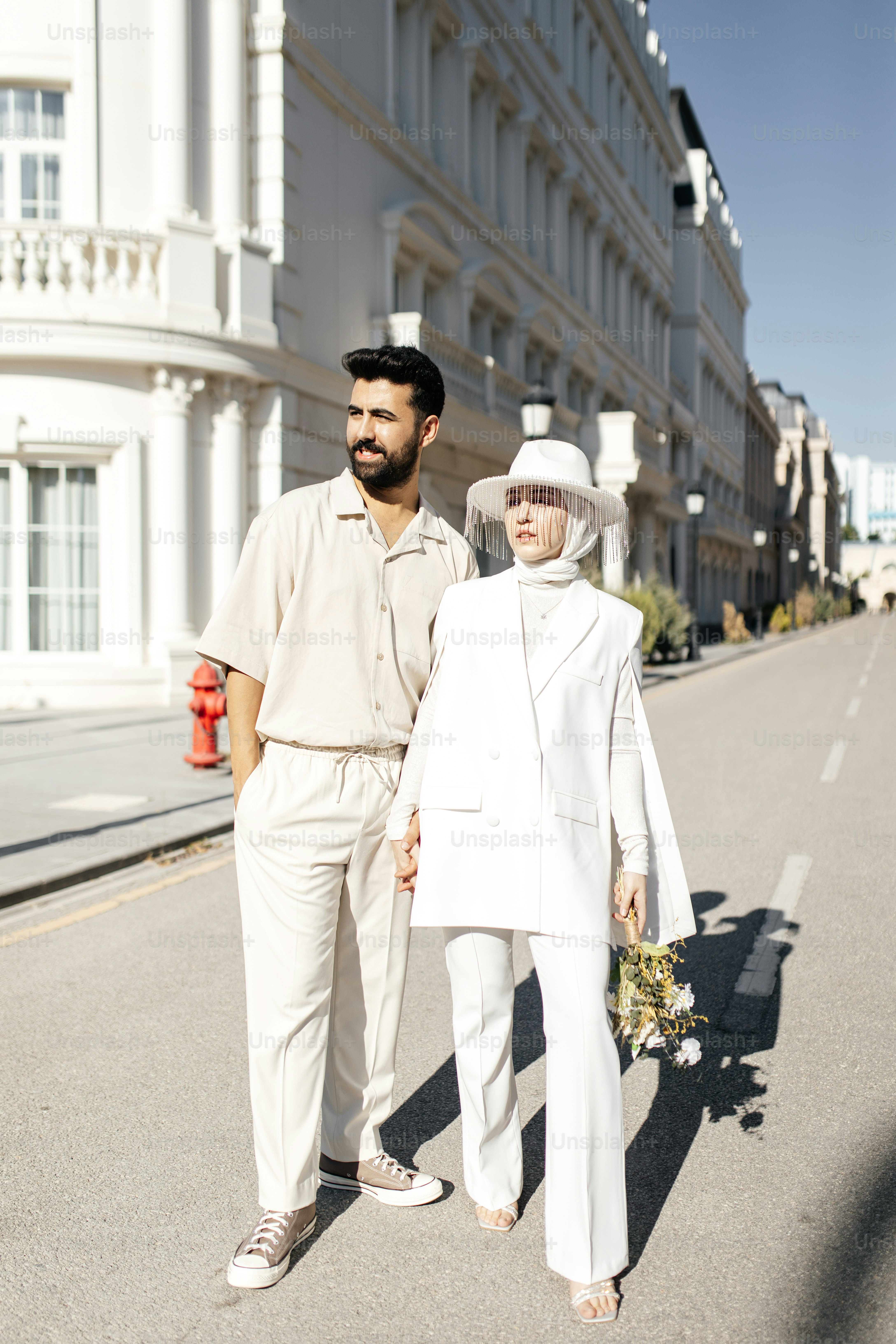 a man and a woman walking down a street
