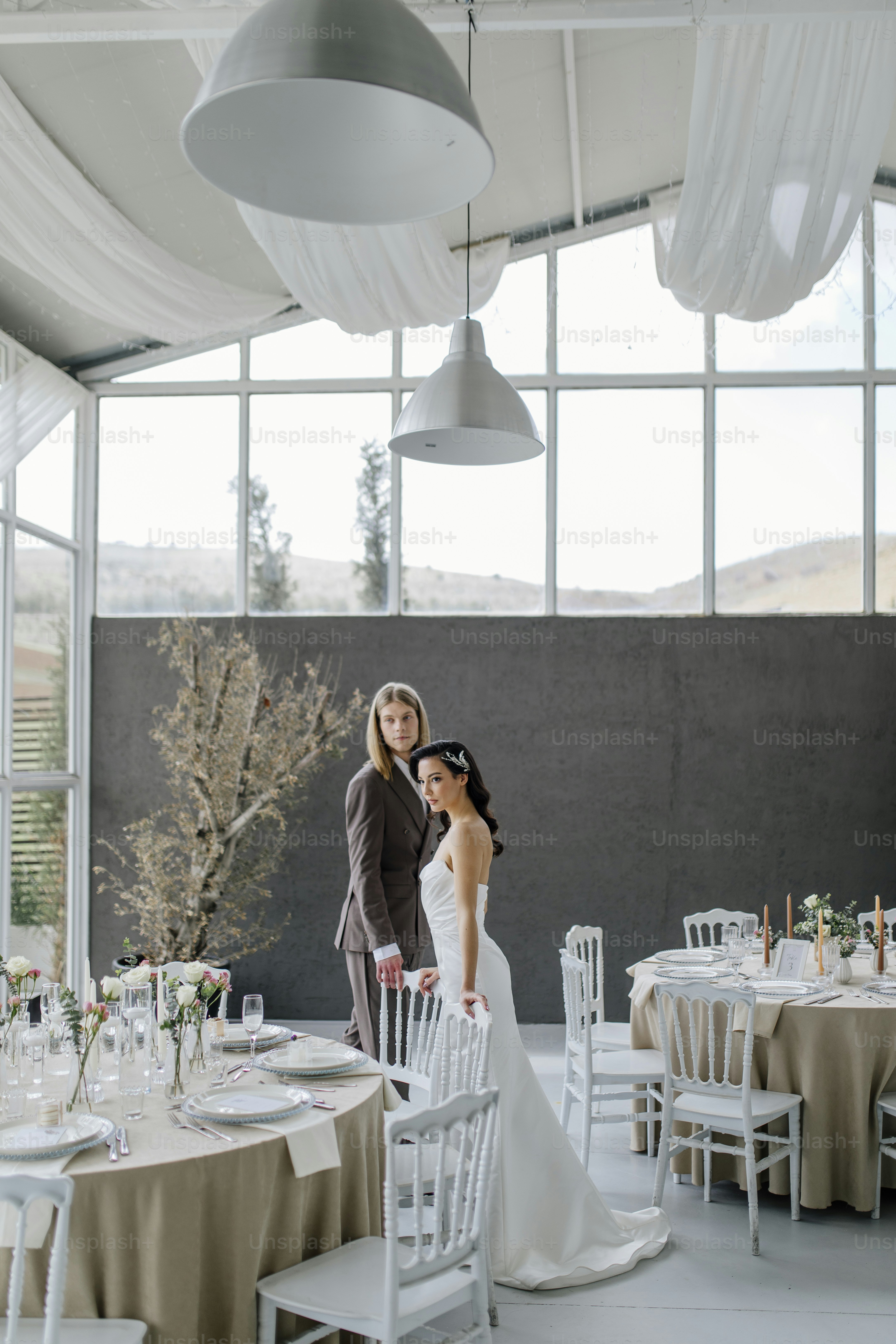 a bride and groom standing next to each other