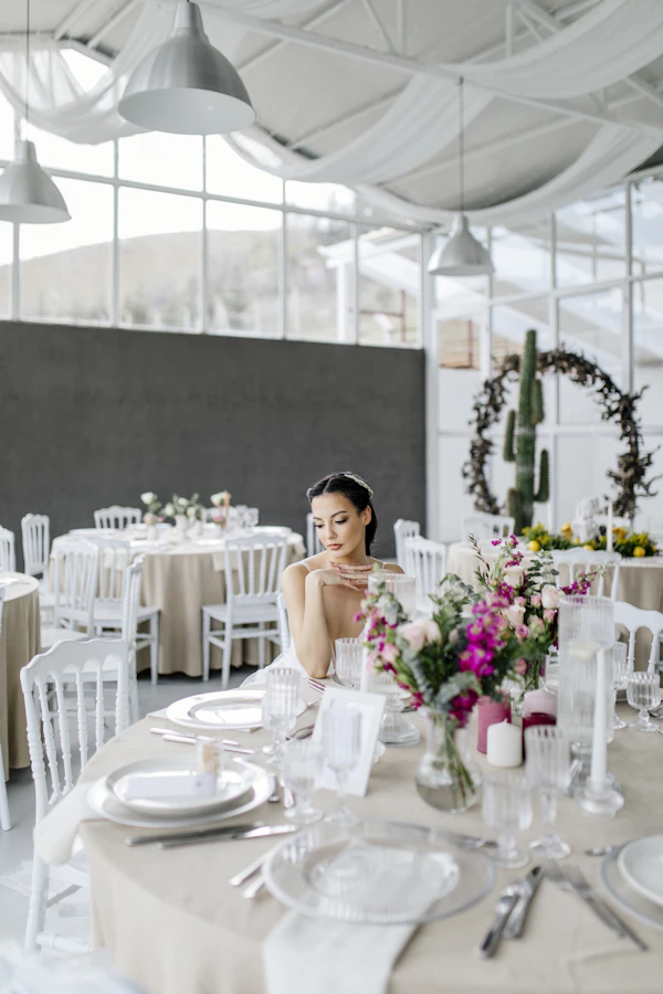 Nashville wedding venue - a woman sitting at a table in a restaurant
