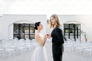 a man and a woman standing next to each other