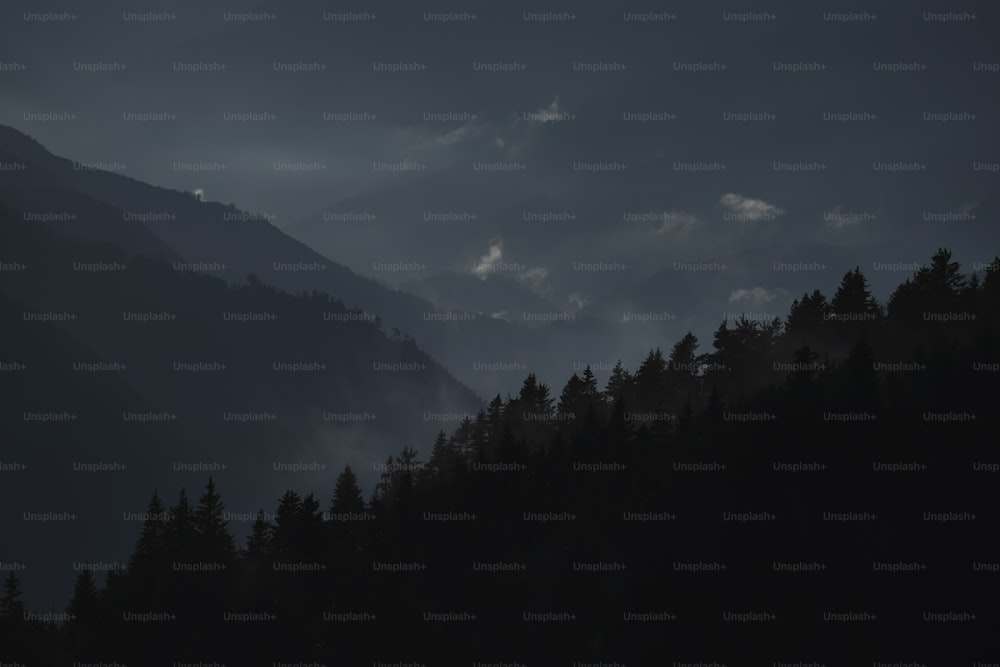 a black and white photo of a mountain range