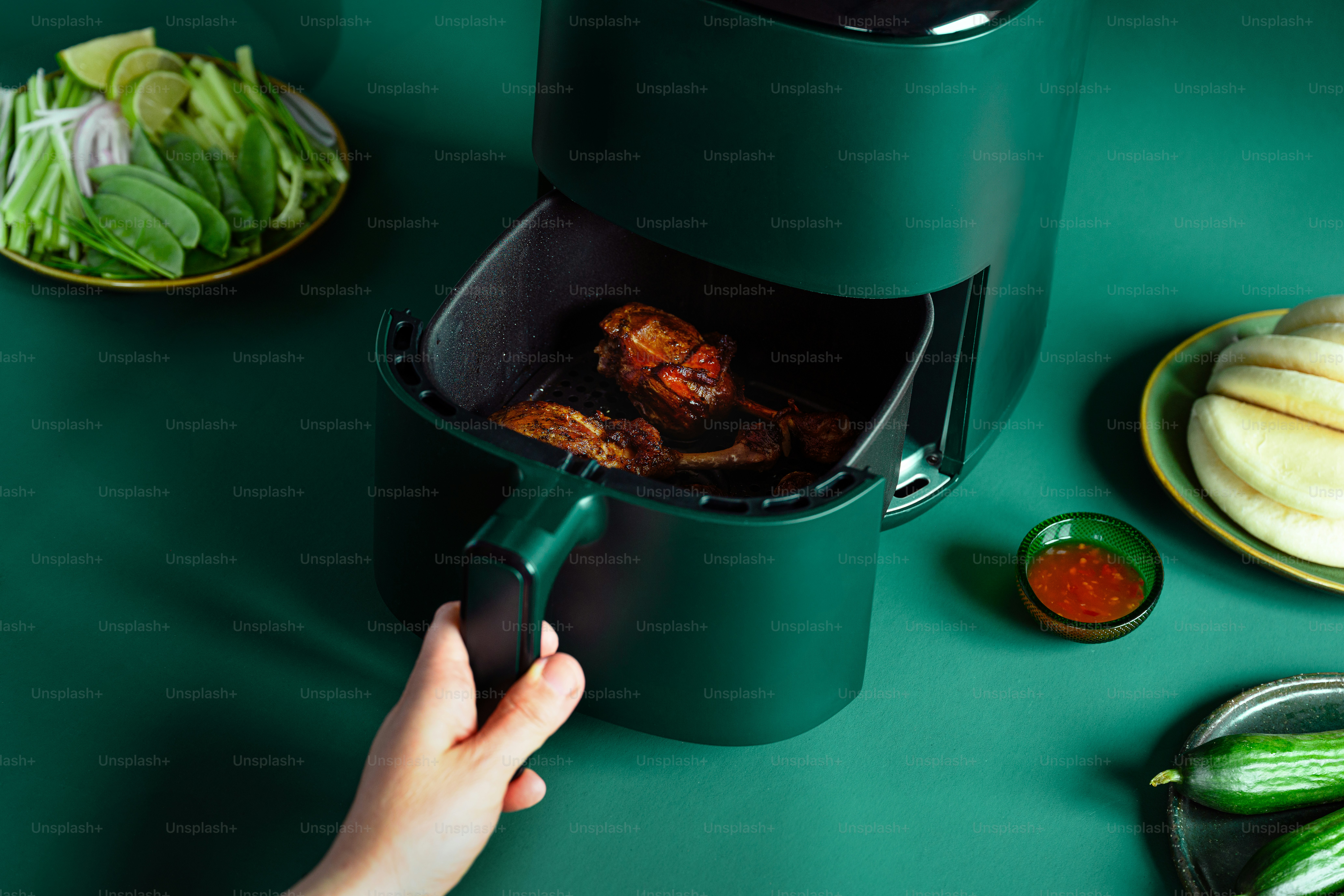 a person is using a meat grinder to cut meat