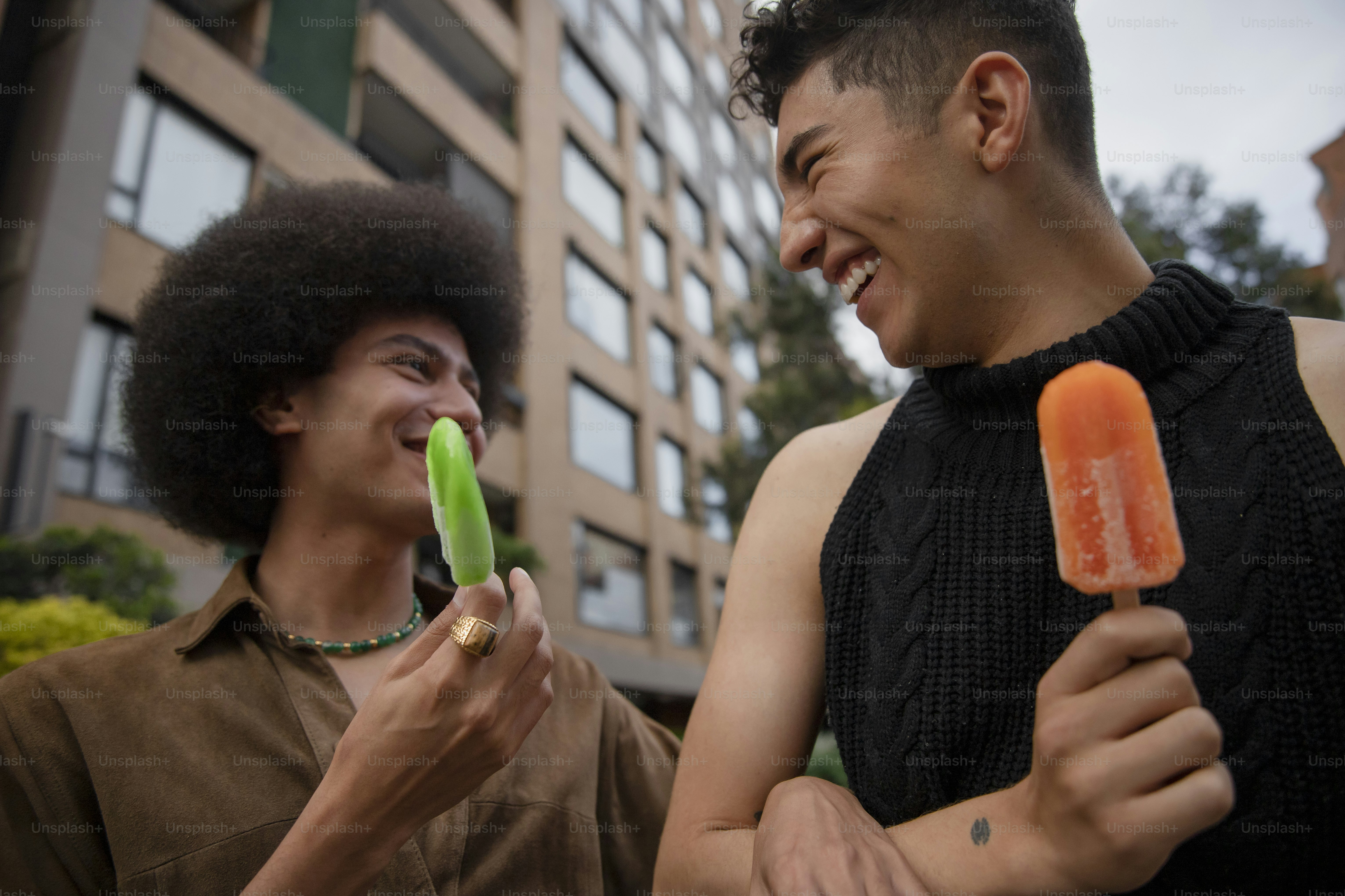 a couple of men standing next to each other