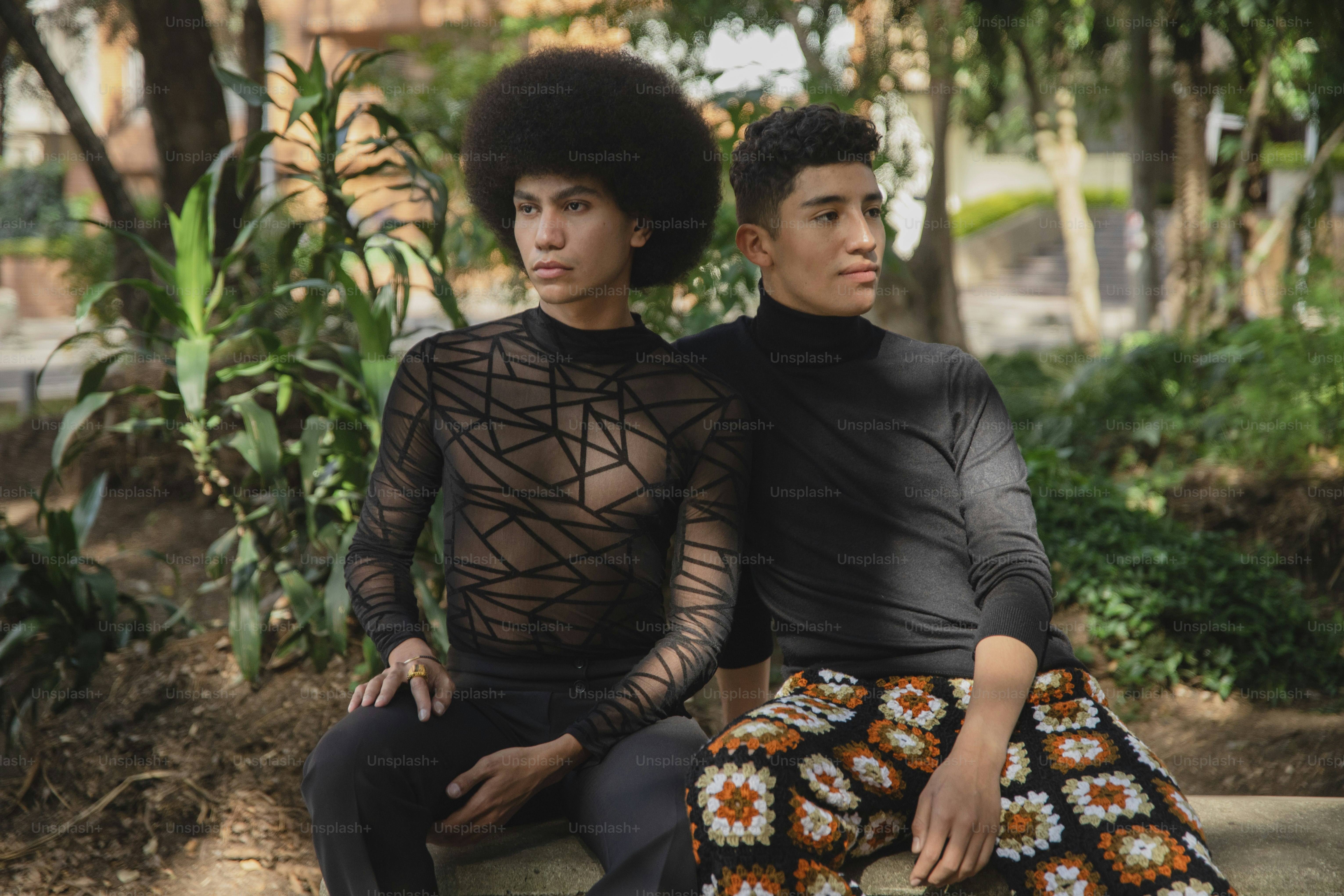 a man and a woman sitting on a bench