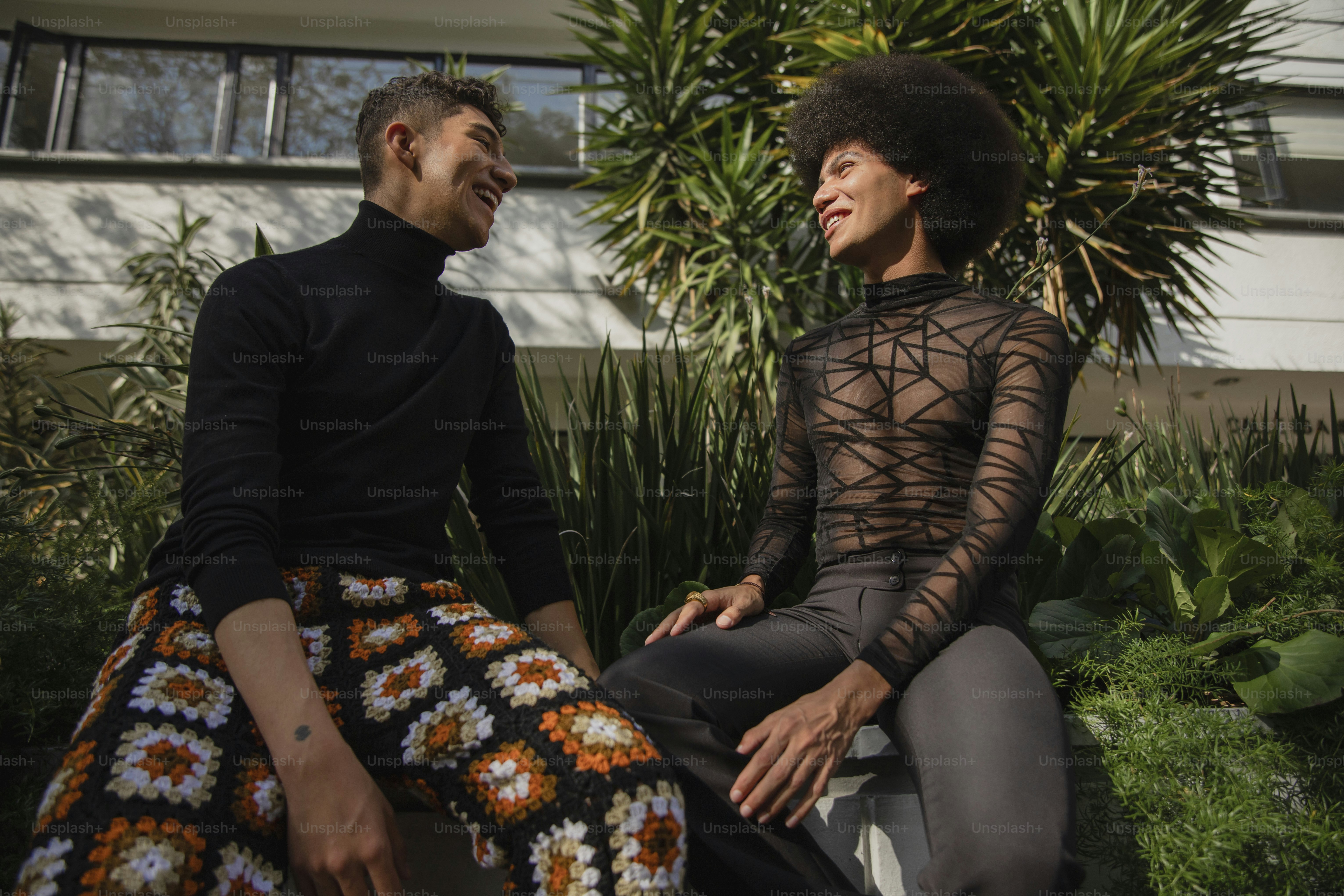 a man and a woman sitting on a bench