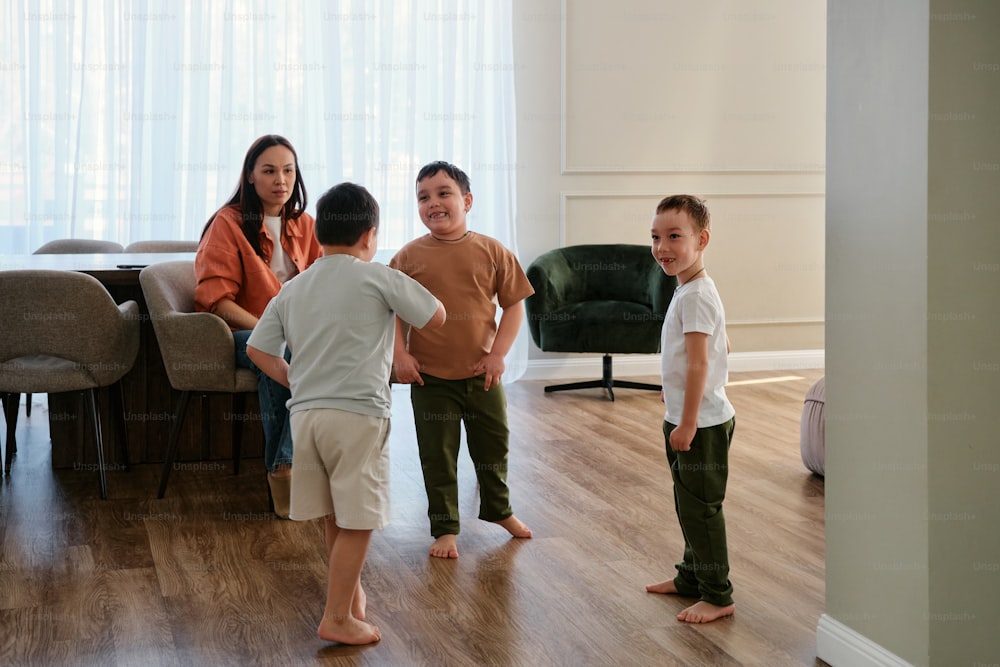 a group of people standing around a living room