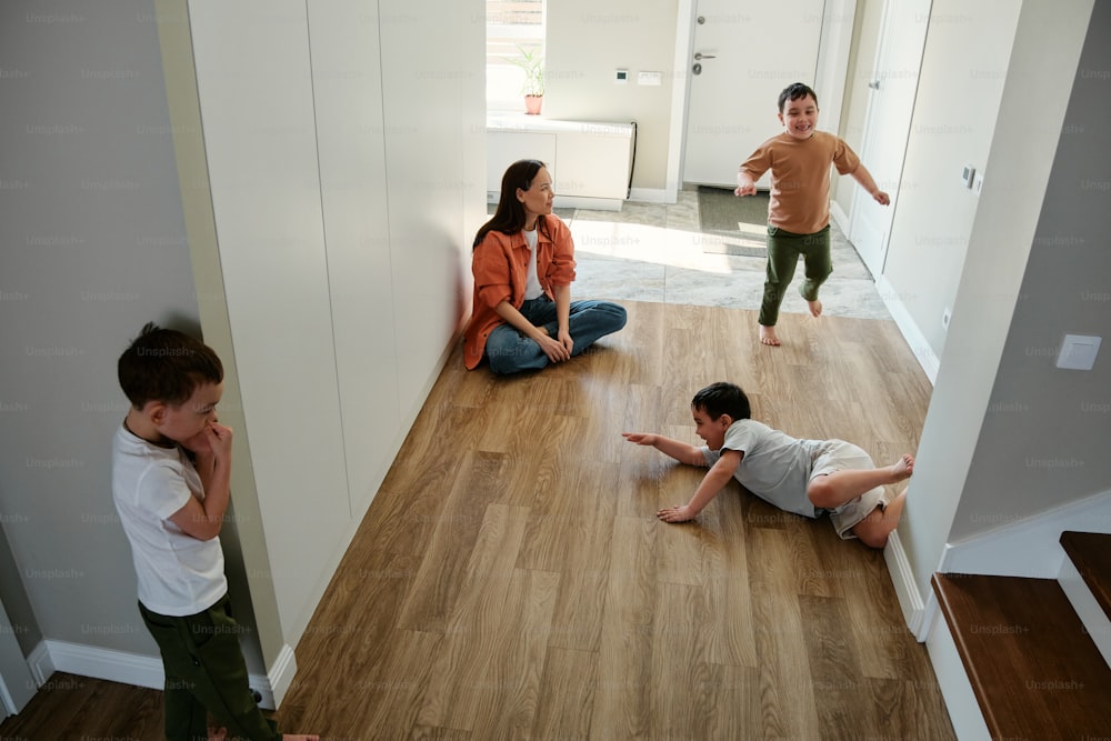 a group of people sitting on the floor in a room