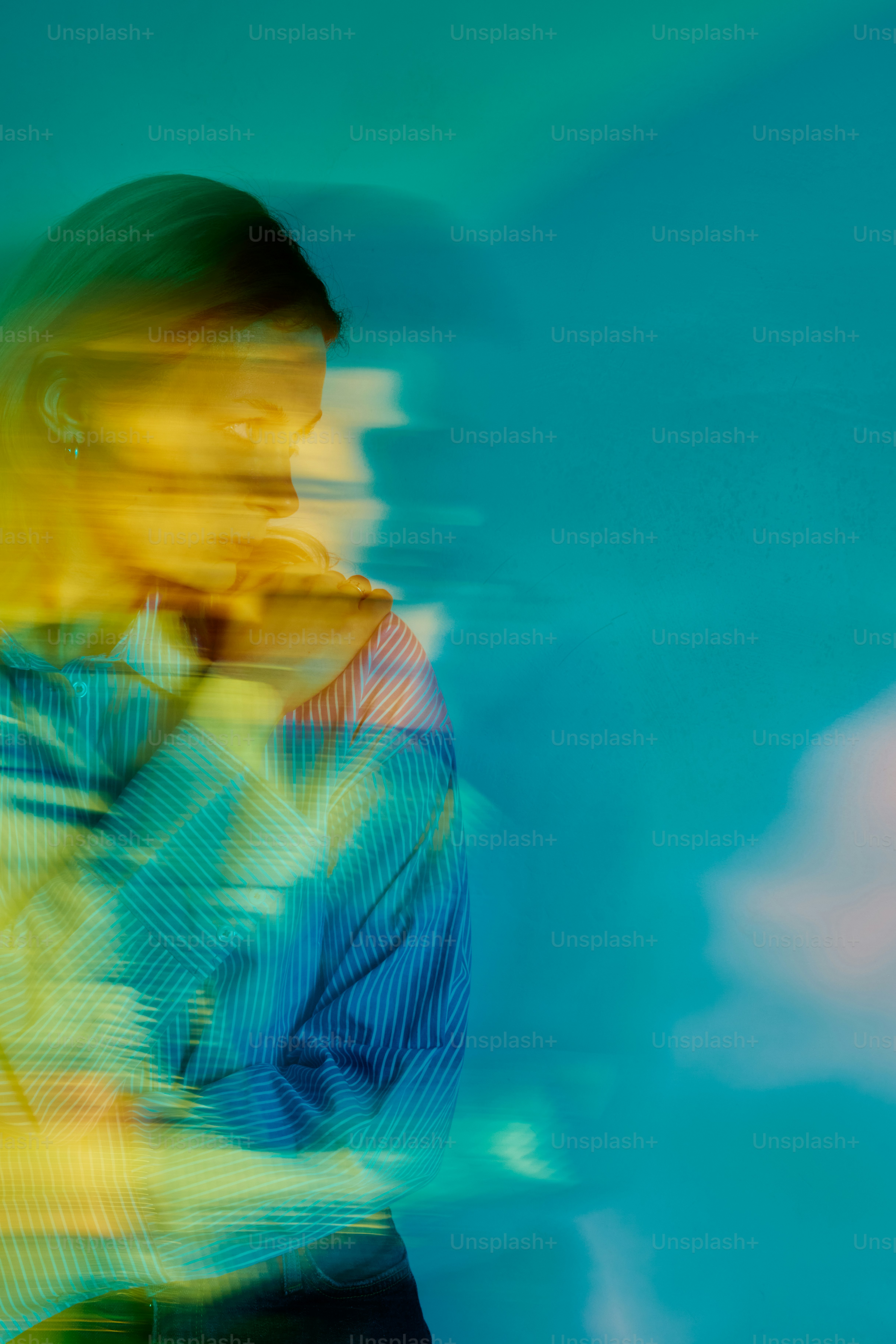 a blurry photo of a person holding a cell phone